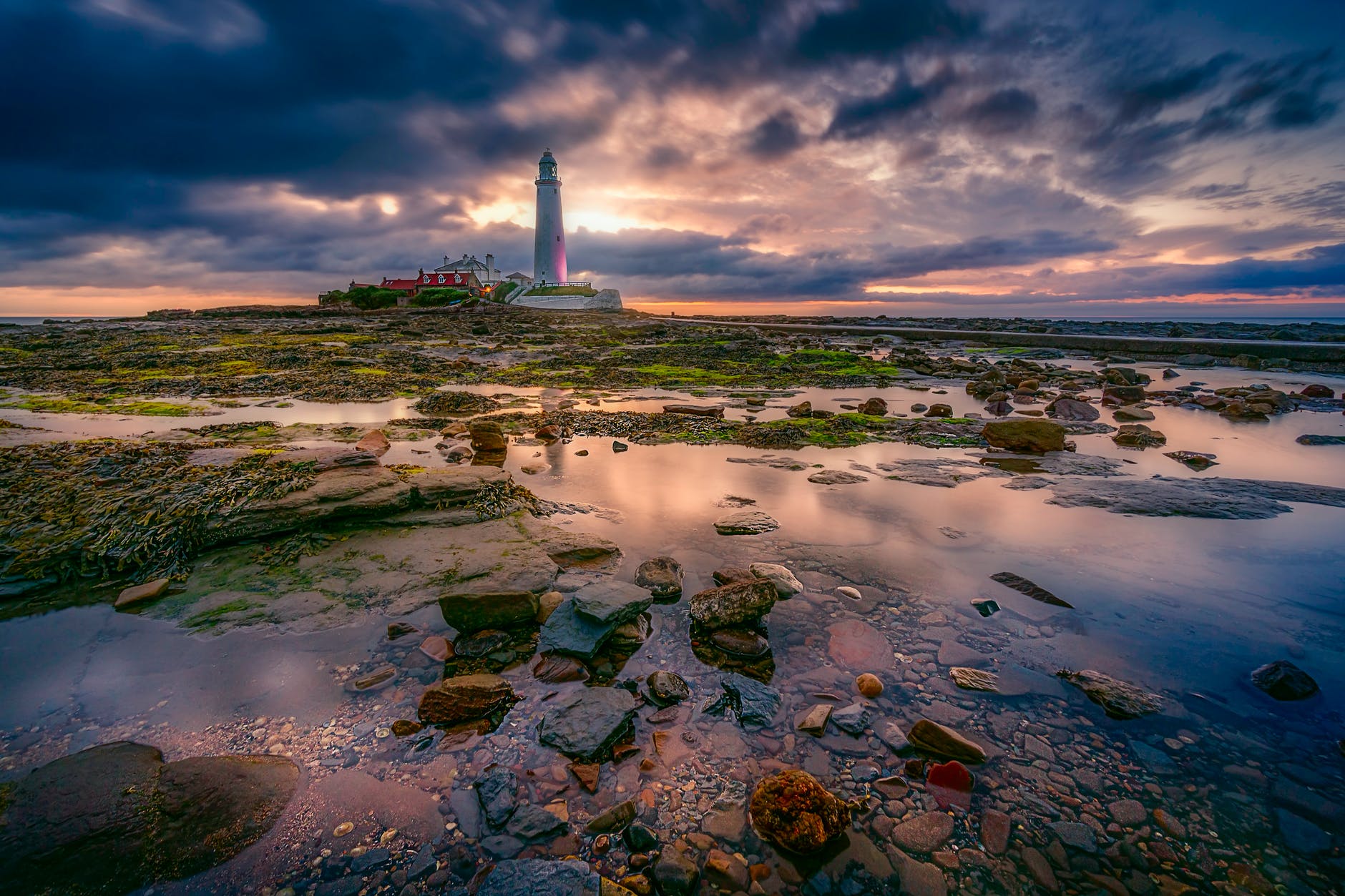 landscape photography of white lighthouse during cloudy daytime