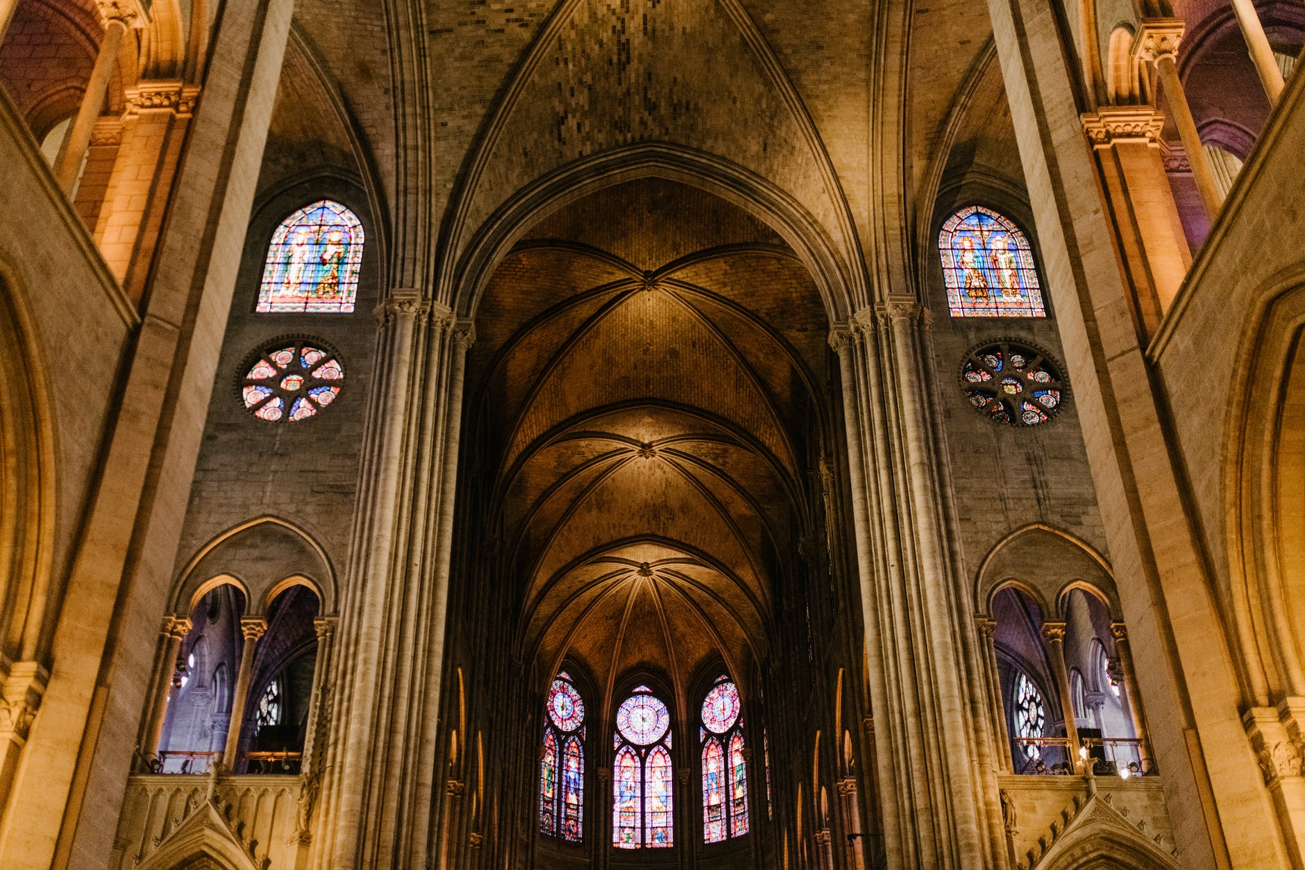 ornamental ceiling with arched mosaic windows of church