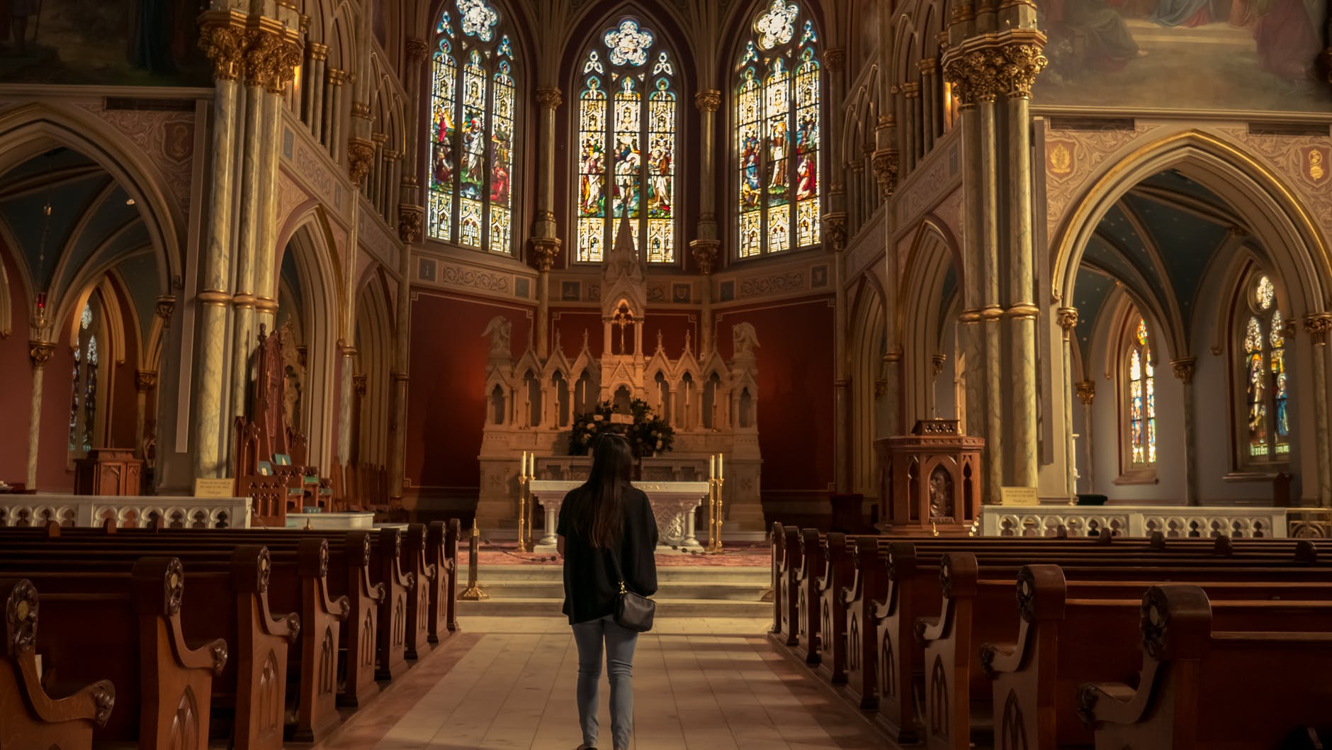 girl in front of church alter