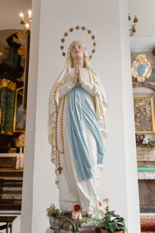 virgin mary statue in white room